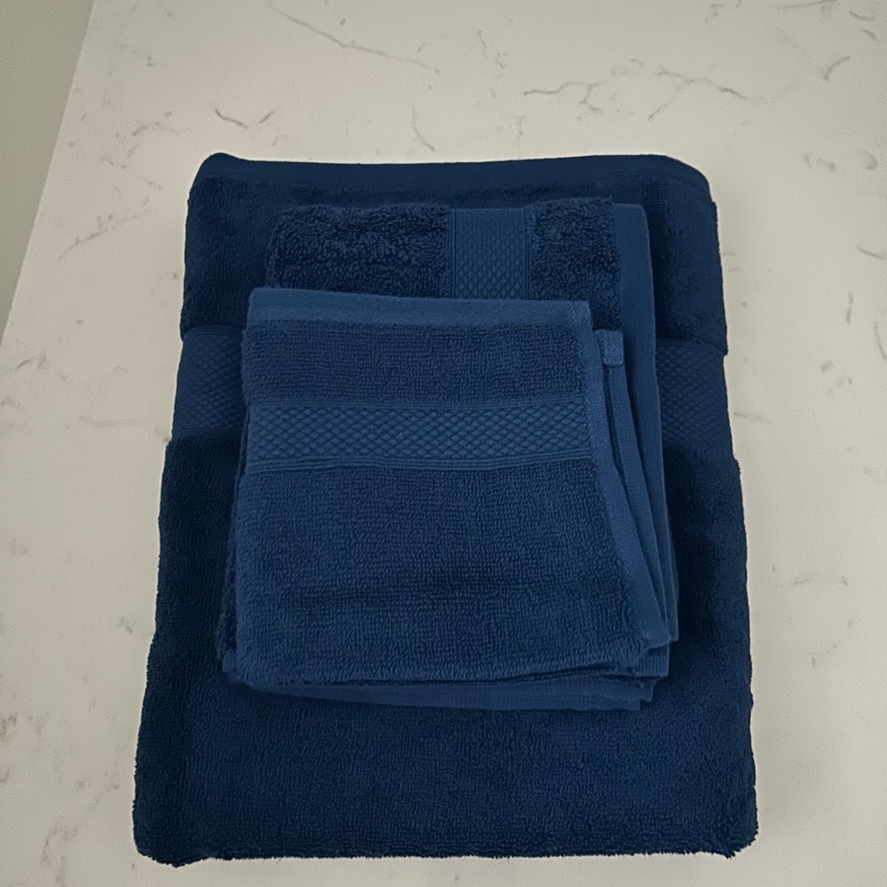 A 6 set Peacock Alley Deep Blue Bath Towel Set
